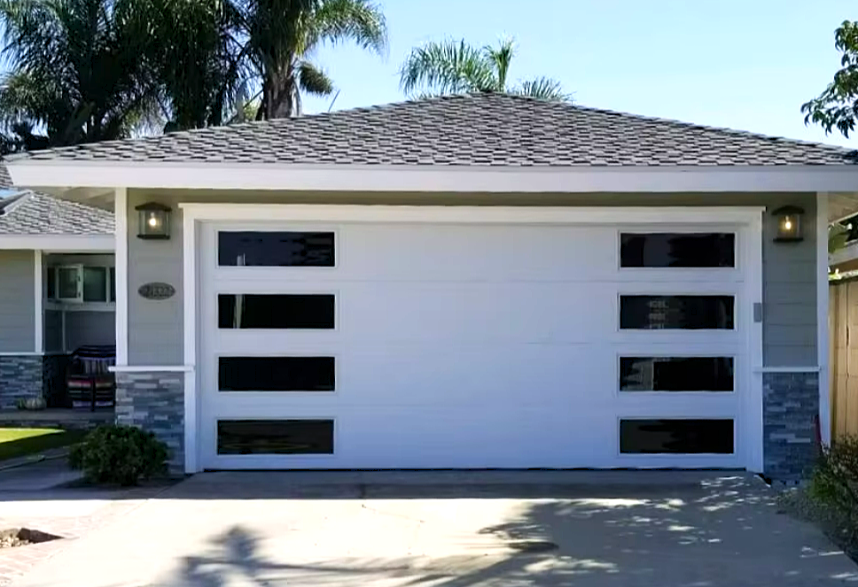 Garage door repair technician fixing a garage door in Bradenton, FL.