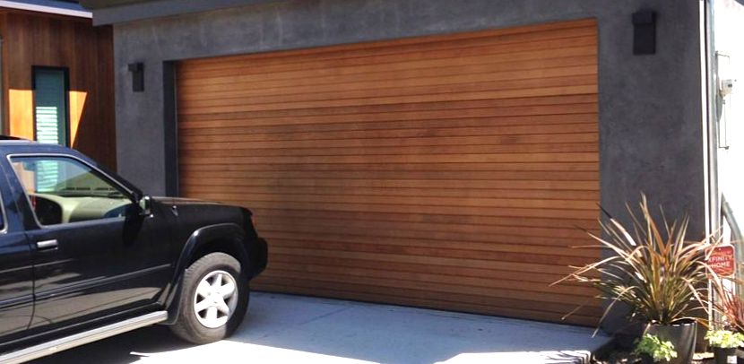 Professional technicians performing garage door repair at a residential home in Bradenton, FL, showcasing local garage door repair services.