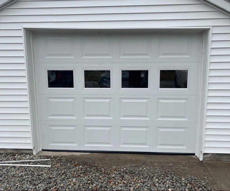 Technician performing garage door repair service in Bradenton, FL - Expert solutions for all garage door repair needs.
