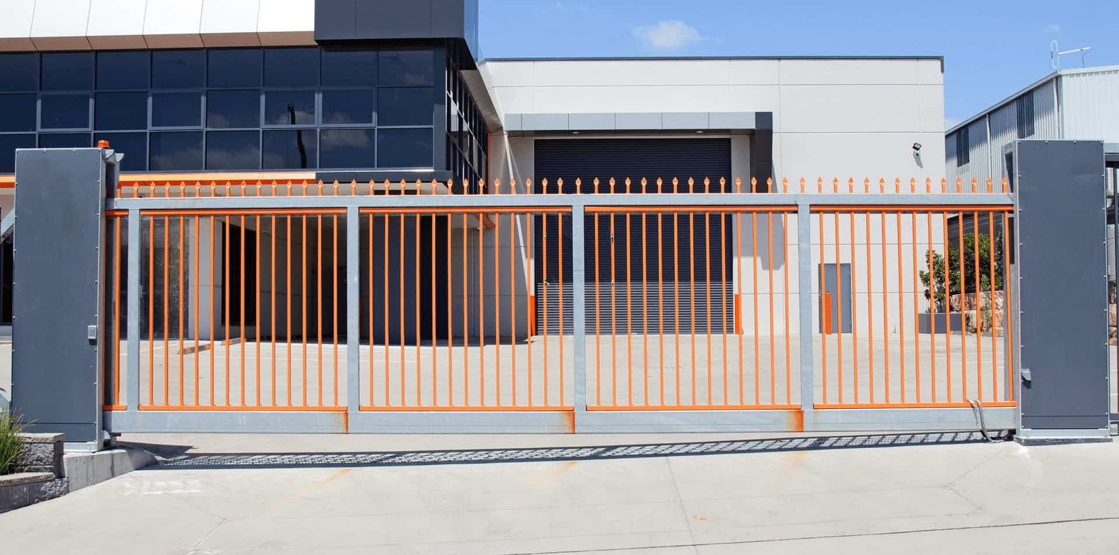 Professional repairing a commercial gate in Bradenton, FL, specializing in commercial gate repair services