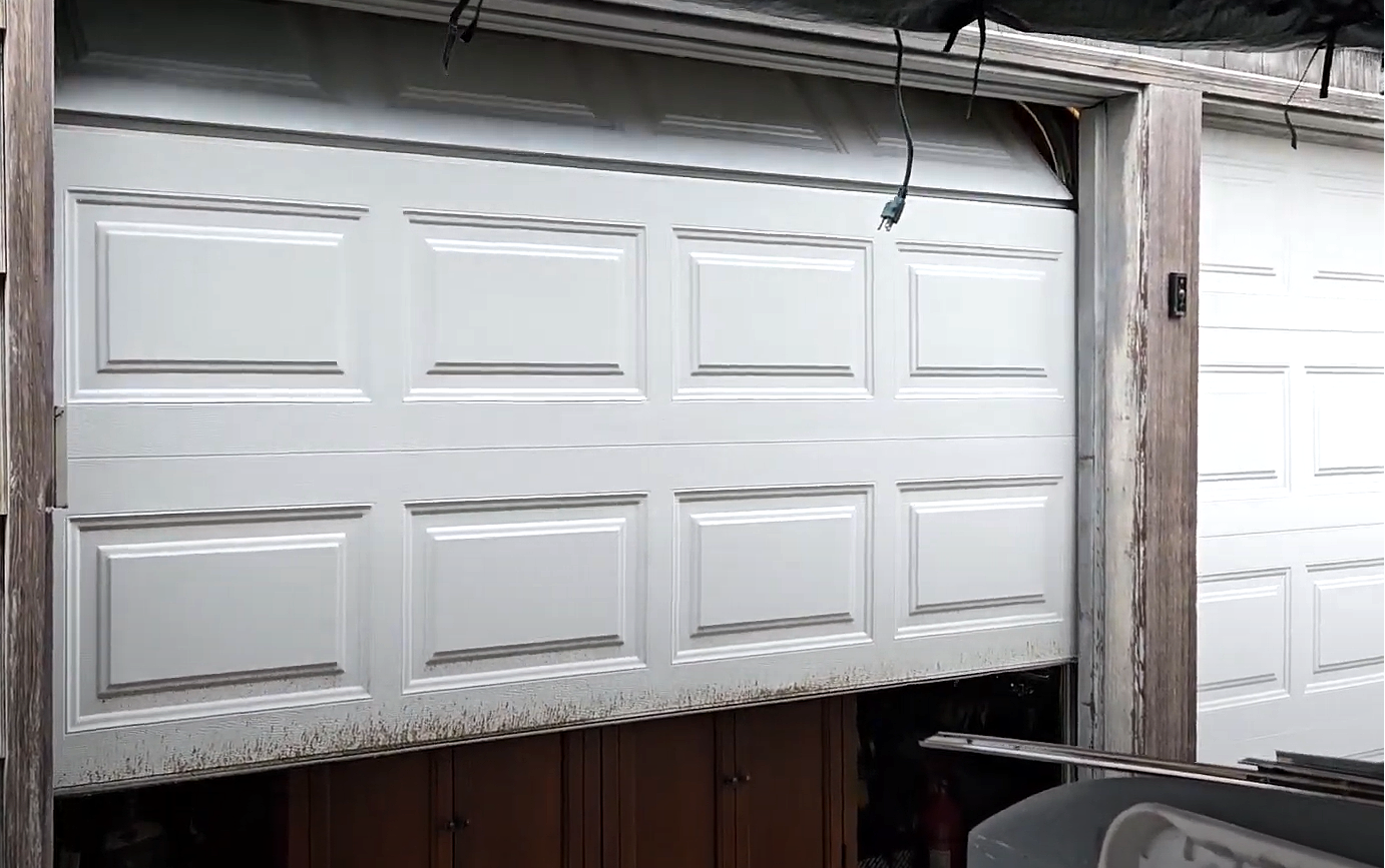 Professional garage door panel repair in Bradenton, FL, showcasing before and after views of the repair work