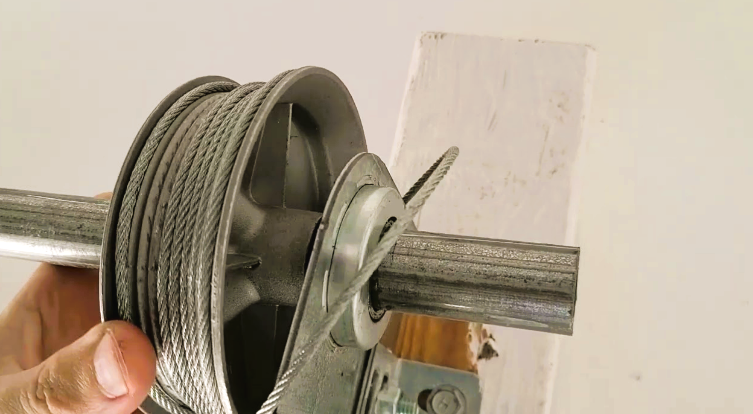 Technician repairing a garage door cable on a residential garage door in Bradenton, FL – Garage Door Cable Repair