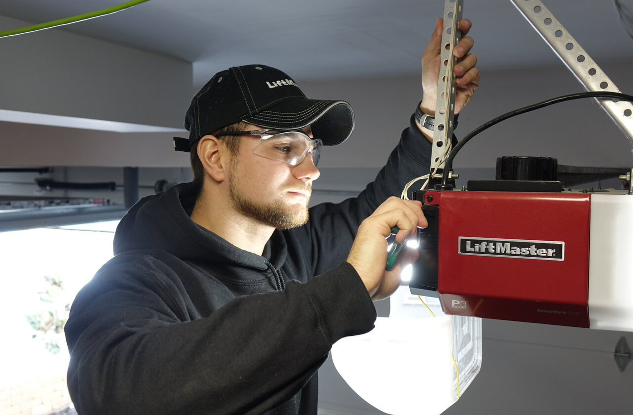 Professional garage door opener installation by a technician in Bradenton, FL.